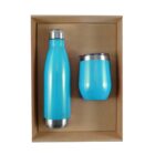 A rectangular cardboard box containing a blue insulated water bottle with a silver cap and a matching blue insulated tumbler with a clear lid, both designed for keeping beverages hot or cold.