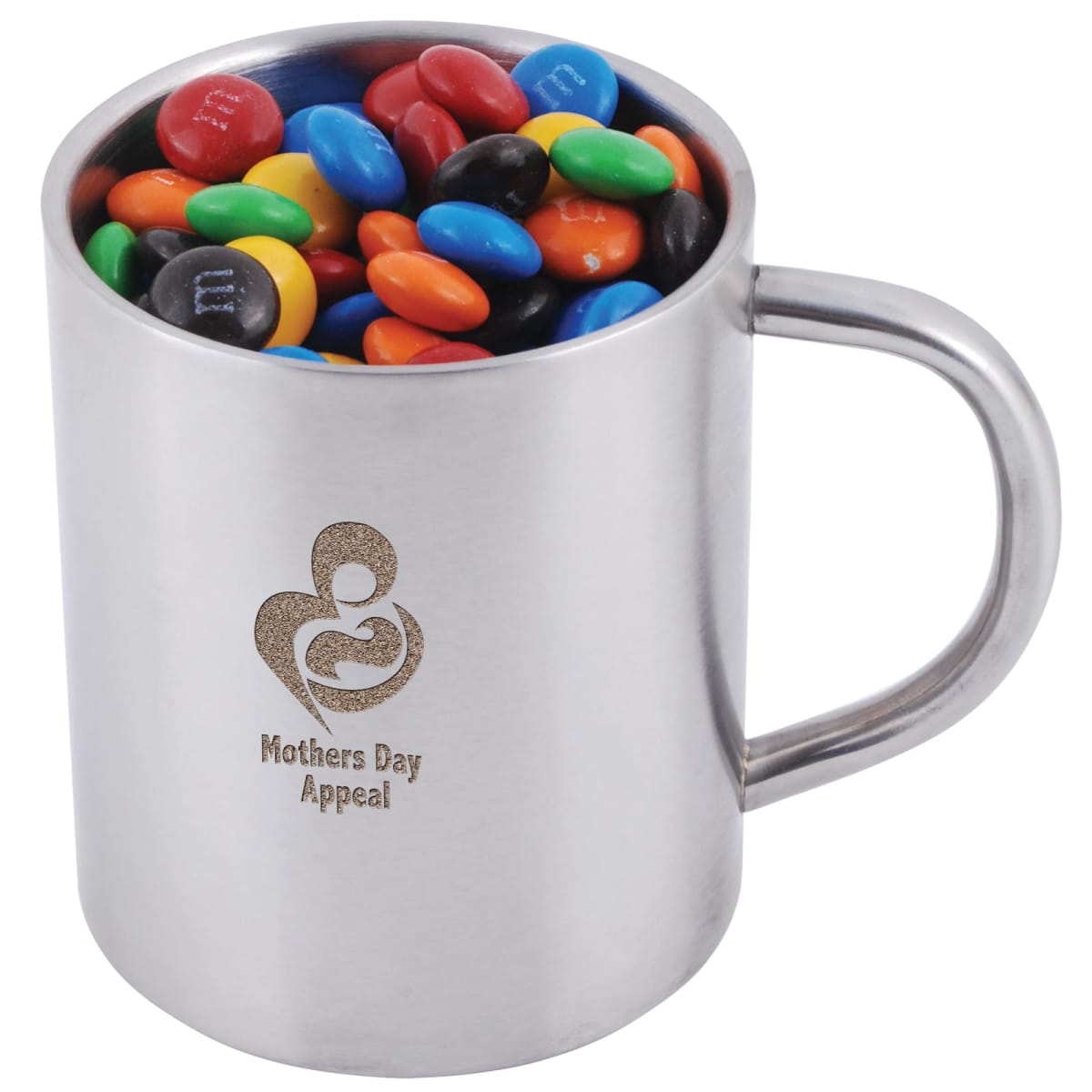 A silver mug filled with colorful chocolate candies. The mug has a Mothers Day Appeal logo, featuring a stylized heart and figures, engraved on its side.