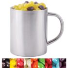 A silver metal mug filled with yellow and dark-colored jelly beans. Below the mug, theres a strip showing various jelly beans in red, white, orange, yellow, and black colors.