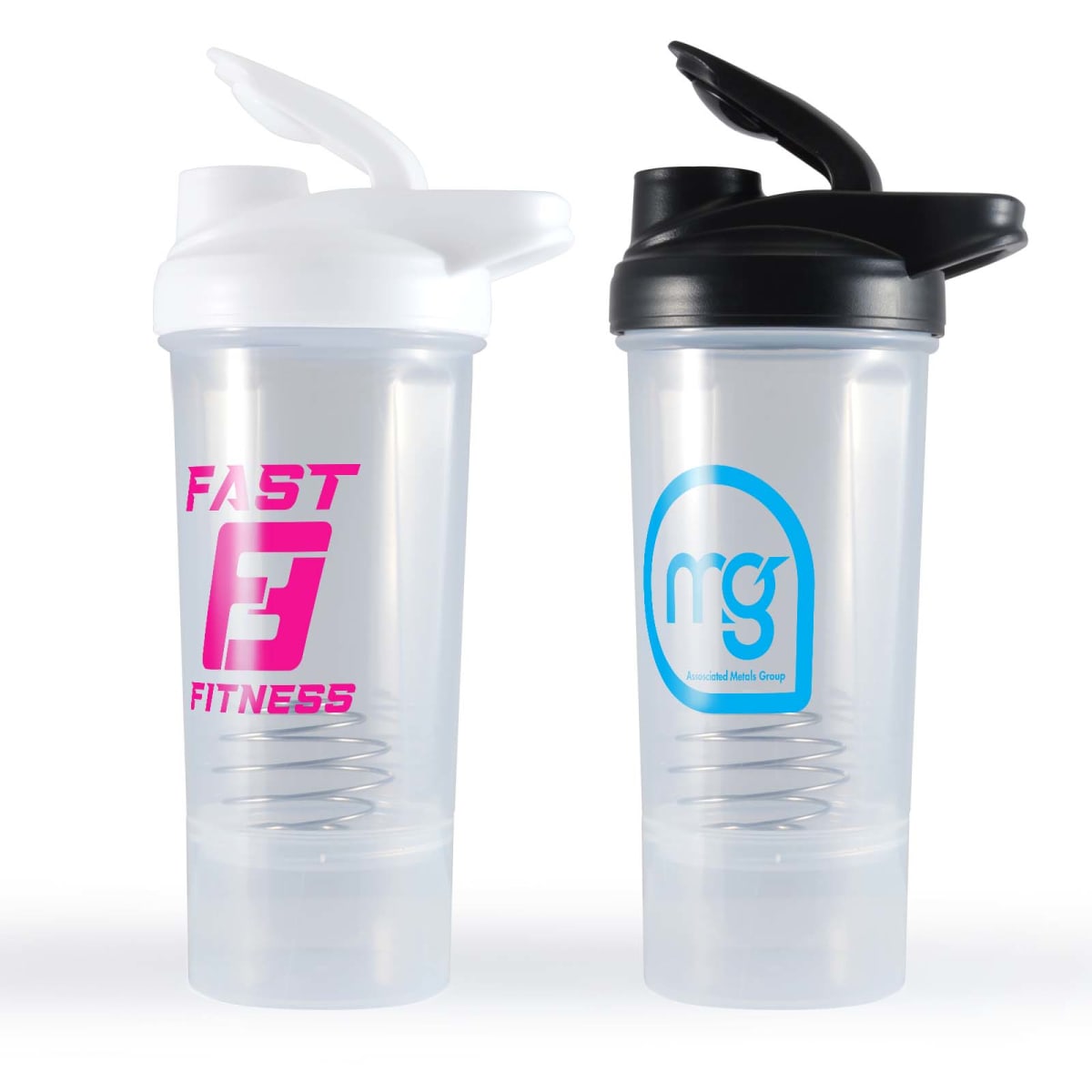 Two transparent shaker bottles are shown side by side. The left bottle has a white lid and a pink Fast Fitness logo. The right bottle has a black lid with a blue circle logo containing the letters mg. Both bottles have an internal mixing ball.