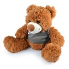 A fluffy brown teddy bear with a gray vest, sitting upright. The bear has a light brown snout and black eyes, appearing soft and cuddly.