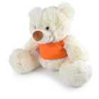 A fluffy, light-colored teddy bear wearing a bright orange vest sits facing slightly to the left. Its nose is brown, and it has a smiling expression. The bear is positioned on a plain white background.