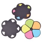 Two flower-shaped sticky note pads are shown. One is closed, revealing cut-out petal shapes, while the other is open, displaying colorful petals in blue, pink, yellow, and green against a black background.