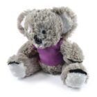 A plush koala toy wearing a purple shirt, sitting with its legs stretched out. The koala has light gray fur, dark eyes, and a black nose, with its ears slightly tilted outward.