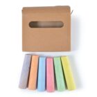 A brown cardboard box with an oval cutout is displayed above six pieces of colorful chalk in a row. The chalk colors are purple, orange, blue, red, green, and yellow.