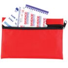 A red zippered pouch with bandages and antiseptic wipes partially visible inside.