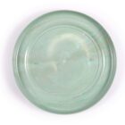 A round, translucent, mint green frisbee with a smooth surface and slight marbling effect. Text Made in Australia is visible near the edge. The frisbee is set against a plain white background.