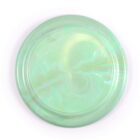 A round, translucent plate with a smooth, glossy finish. The plate features a swirling, marble-like pattern in shades of pale green, with hints of iridescent reflections on its surface. The background is plain white.