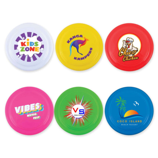 Six colorful frisbees with logos: Kids Zone on white, Kanga Kampers on yellow, Chico Chicken on red, Vibes Music Fest on pink, VS Visual Systems on green, and Coco Island Beach Resort on blue.