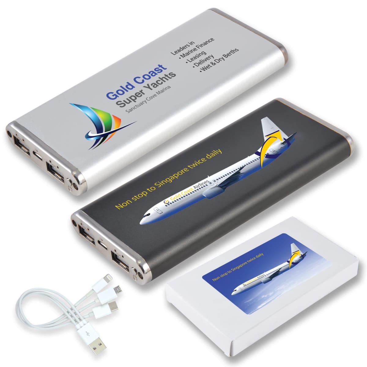 Three portable power banks with aviation-themed branding are shown. Two are silver and gray with an airplane image and text. Includes a USB cable and a branded box featuring a plane.