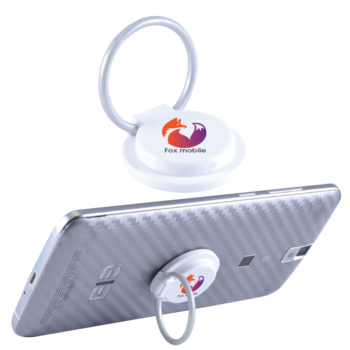 A smartphone with a carbon fiber-patterned back has a white circular finger ring holder attached. The holder features an orange and purple fox logo with the text Fox mobile underneath. The ring allows the phone to stand upright.
