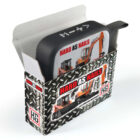 A box labeled Hard As Nails contains a black and silver case with construction images on it. The box and case display graphics of heavy machinery. The packaging features a metallic-like, textured design.