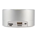 A close-up view of the back panel of a cylindrical electronic device with a white and silver finish. It features various ports including a micro USB port, a USB port, and slots for SD cards.