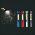 Four LED pen flashlights in blue, red, black, and silver are displayed vertically on a dark background. To the left, a hand uses a flashlight to illuminate an engine.