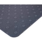 Close-up of a dark gray mat with a dotted and floral pattern on a white background.