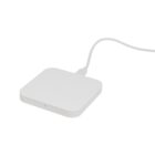 White wireless charging pad with a cable attached.