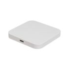 Square white wireless charging pad with a micro-USB port on a white background.