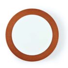 Round wall mirror with a brown wooden frame.