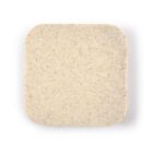 Square bar of speckled soap on a white background.