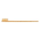 Bamboo toothbrush with light bristles, side view, isolated on white background.