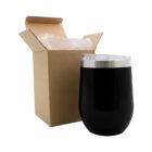 Black insulated tumbler with lid beside an open cardboard box.