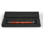 Red pen in a black presentation case.