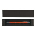 Red pen inside a black gift box with a sliding black lid placed beside it.