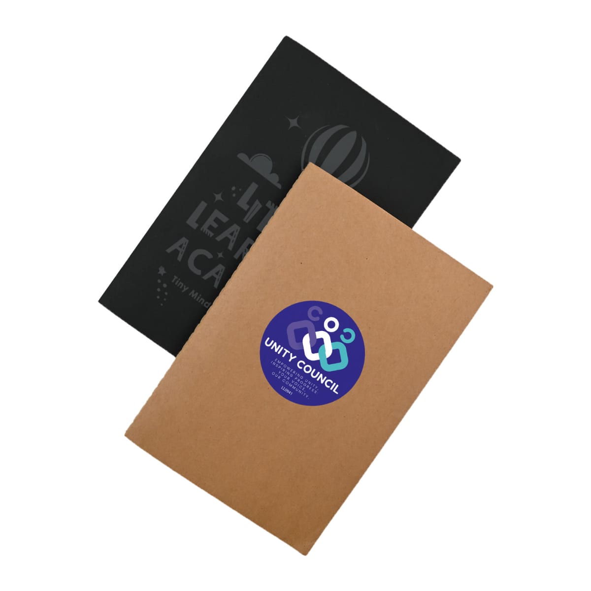 Two notebooks, one black and one kraft, with Unity Council sticker on the kraft cover.