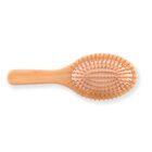 Wooden hairbrush with rounded bristles and an ergonomic handle.
