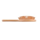 Side view of a wooden hairbrush with rounded bristles on a white background.