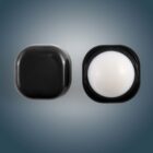 Black container with a rounded white object inside, viewed against a gray background.