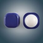 Open and closed dark blue balm container on a gradient background.