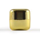Shiny gold, rectangular capsule with a reflective surface.