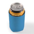 A soda can in a blue koozie on a white background.