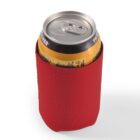A yellow beverage can in a red neoprene sleeve.