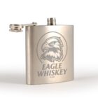 Metallic hip flask with an eagle logo and Eagle Whiskey text on the front.
