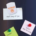 Magnets and notes on a fridge: Meet Jenny at 2pm and reminders for tomatoes and Taylahs birthday.