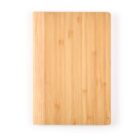 Wooden cutting board with a natural finish, placed vertically on a white background.