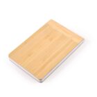 Rectangular wooden cutting board with rounded edges on a white background.