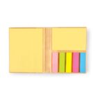 Open notebook with sticky notes and colorful page markers on a white background.