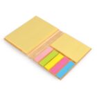 Open notebook with yellow sticky notes and colorful page markers in pink, orange, green, yellow, and blue.
