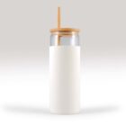 Clear glass cup with a bamboo lid and straw, wrapped in a white sleeve, set against a plain background.