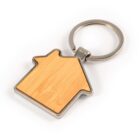 House-shaped wooden keychain with a silver metal ring on a white background.