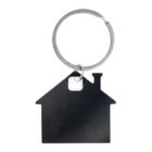 A black house-shaped keychain hangs from a silver keyring.