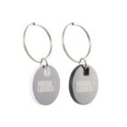 Two keychains with round tags labeled Urban Locker, one white and gray, the other black and gray, on silver rings.