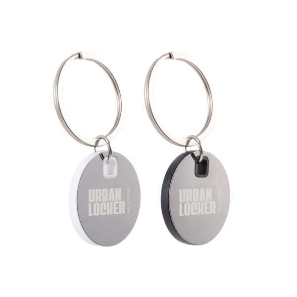 Two keychains with round discs labeled Urban Locker, one white and silver, the other black and silver.