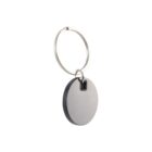 Silver round keychain with a smooth surface and a metal ring.