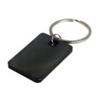 Black rectangular keychain with a silver metal ring attached.