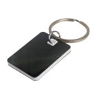 Rectangular black keychain with a silver ring attachment, isolated on a white background.