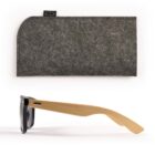 Sunglasses with wooden arms and a gray felt case displayed above them.